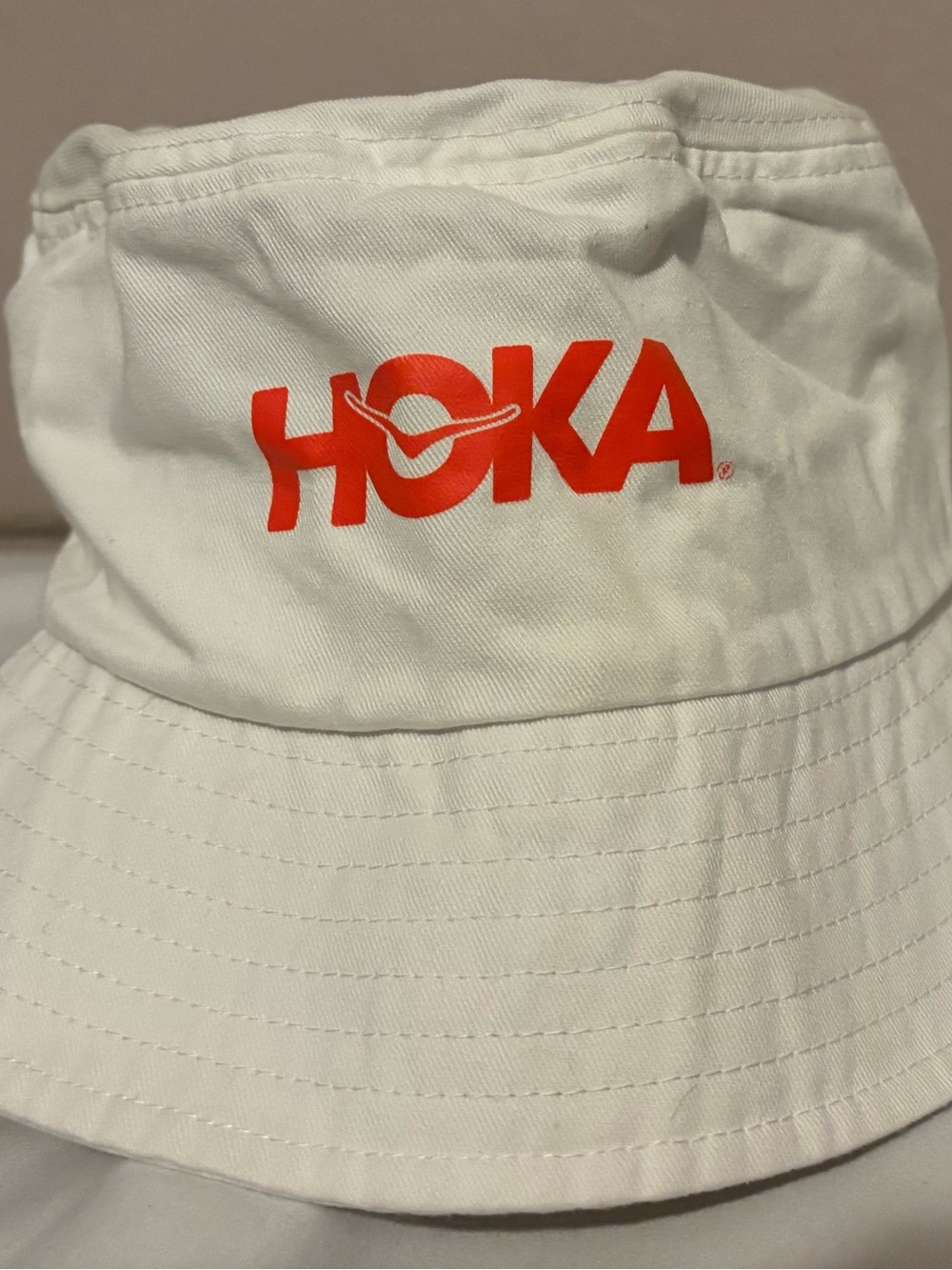 Hoka White Bucket Hat with Bright Orange Logo
